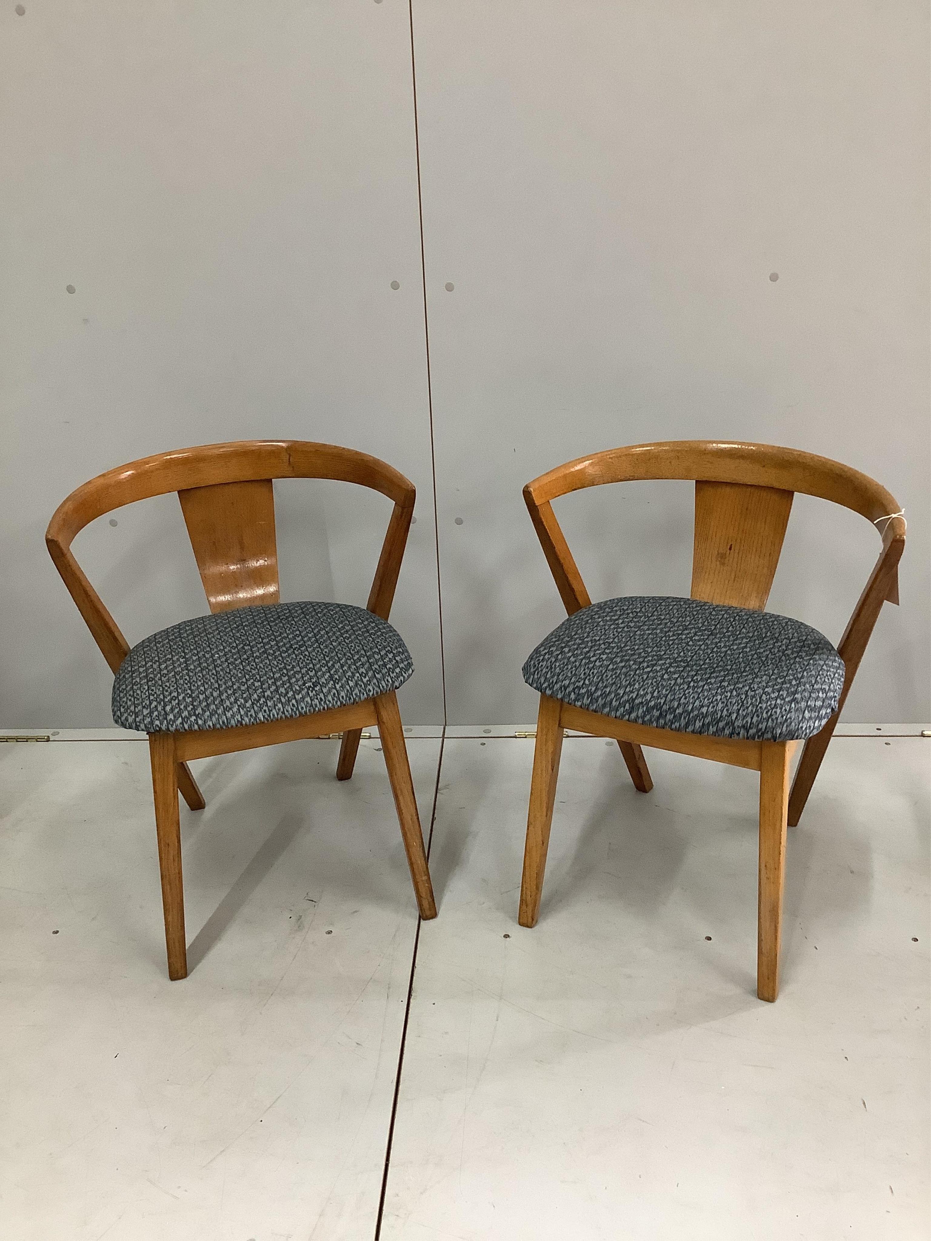 A pair of mid century Greaves & Thomas ‘Put U Up’ oak chairs, width 54cm, depth 48cm, height 48cm. Condition - fair